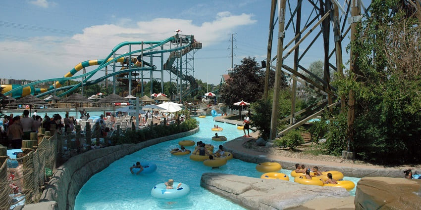 A picture of visitors enjoying the swimming pool and slides at a water park in Vizag