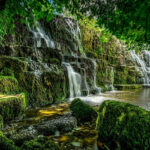 Tourists enjoying at a waterfall in Trichy with its stunning natural beauty for travellers