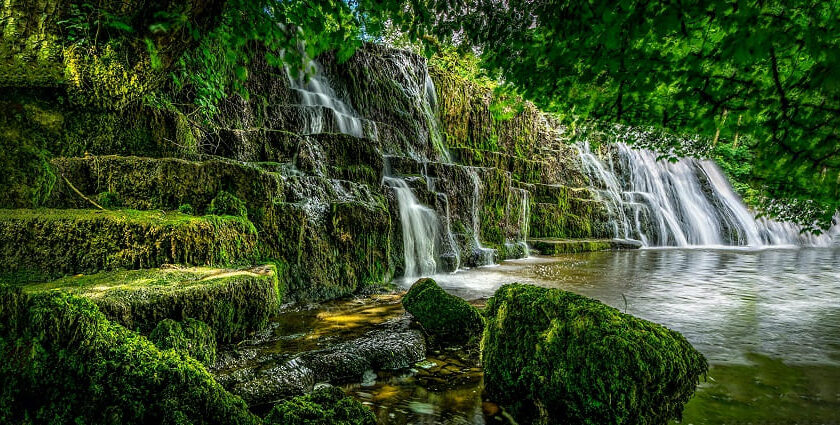 Tourists enjoying at a waterfall in Trichy with its stunning natural beauty for travellers