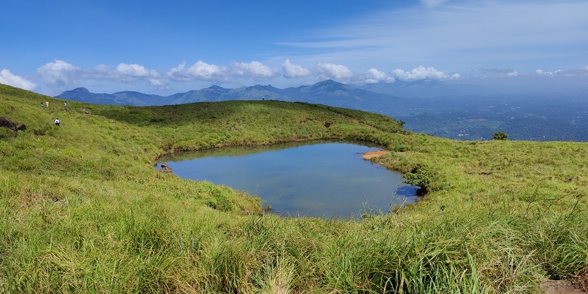 Beautiful view of hills under clear blue sky in Wayanad - Places to visit in May near Bangalore