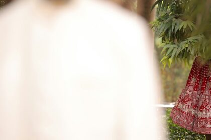 A glimpse of a lehenga and a sherwani, two traditional attires of a bride and a groom.