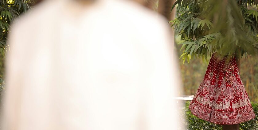 A glimpse of a lehenga and a sherwani, two traditional attires of a bride and a groom.