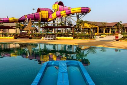 Aerial view of Wet N Joy Water Park Lonavala, featuring water slides and pools.