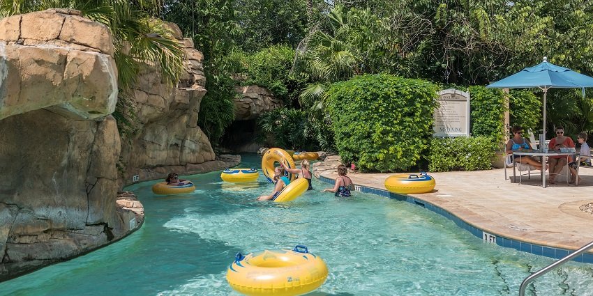 The image of two young girls swimming and playing in a pool in a waterpark in Lonavala.