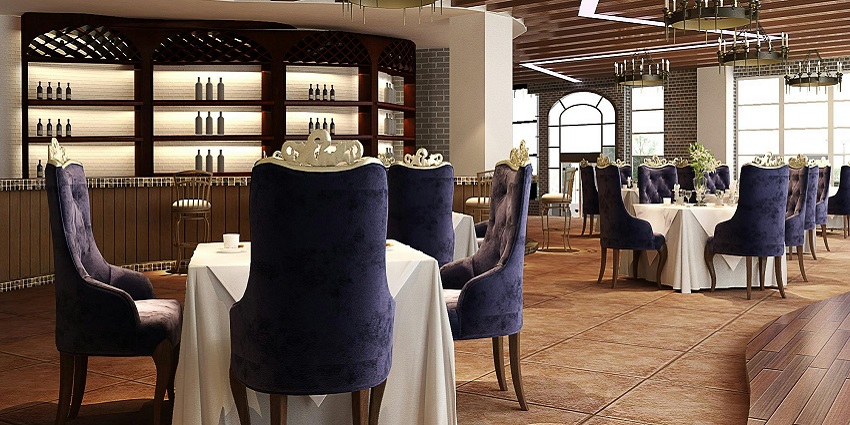 A dining setup with a white tablecloth and purple chairs, creating a vibrant atmosphere.