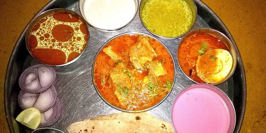A traditional thali from Maharashtra, India, featuring a variety of colourful and flavourful dishes
