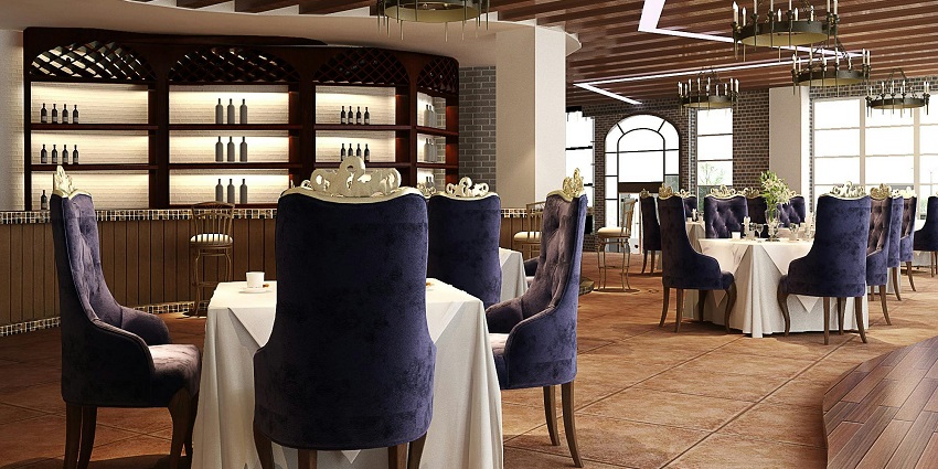 A dining setup with a white tablecloth and purple chairs, creating a vibrant atmosphere.