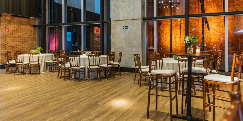 A dining setup with a white tablecloth and brown chairs, creating a vibrant atmosphere.