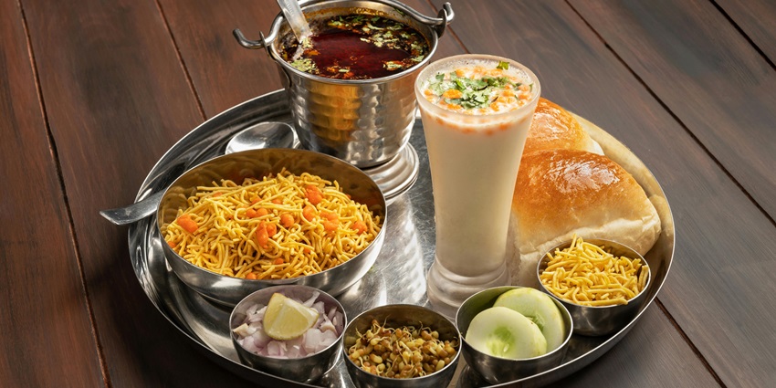 An image of a local eatery near the fort serving traditional Maharashtrian dishes.