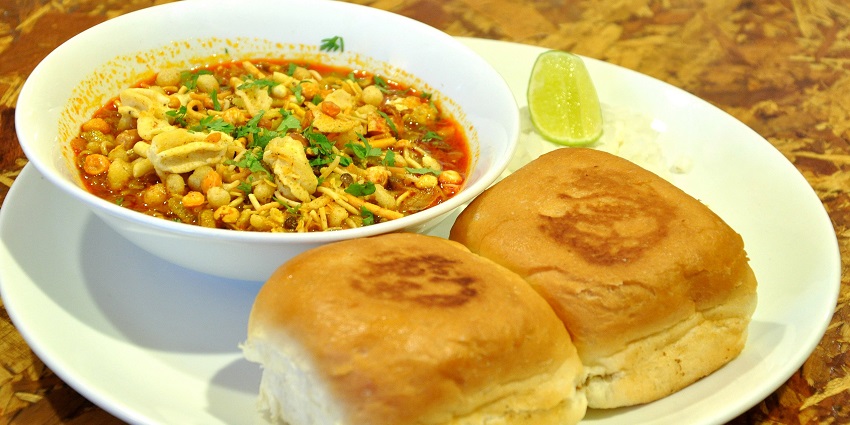 Image of Misal Pav served on a white plate, the local cuisine near Aundha Fort in Maharashtra.