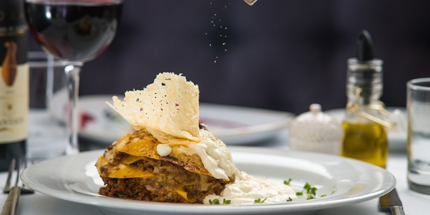 A delicious serving of lasagna with layers of pasta, cheese, and rich tomato sauce.