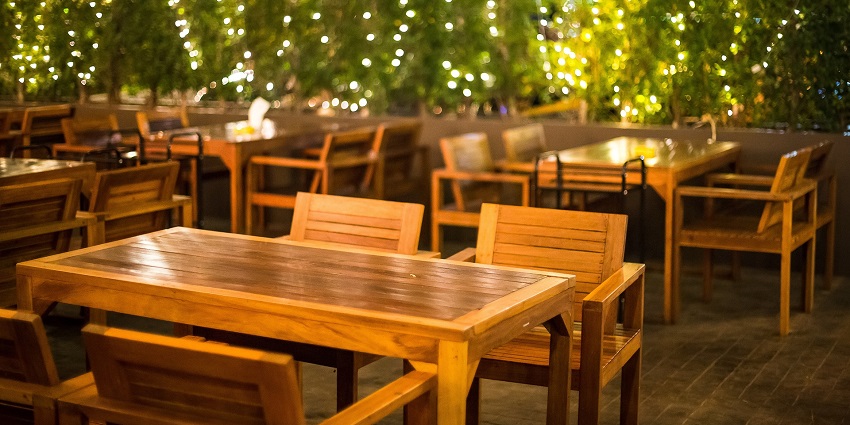 Charming outdoor bar restaurant with brown decor, offering a relaxed and cosy atmosphere