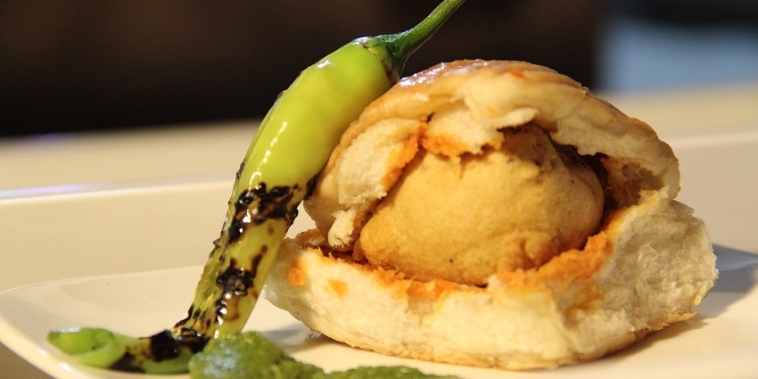 Image of delicious vada pav served on a white plate - one can enjoy local food in Mumbai