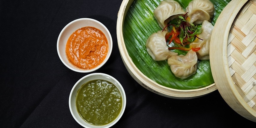 Delicious momos served on a plate, showcasing traditional dumplings at a restaurant.