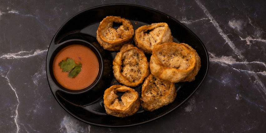Delicious momos served with spicy red chutney, a local delicacy served at a nearby restaurant