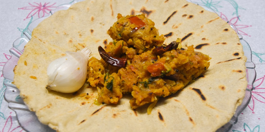 Bhakar, a flat round roti with Jhunka, a yellow colour sabji, a Maharashtrian delicacy