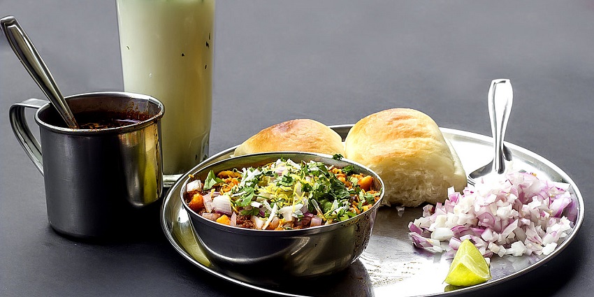 Vibrant kitchen scene in a restaurant showcasing various dishes and food preparations.