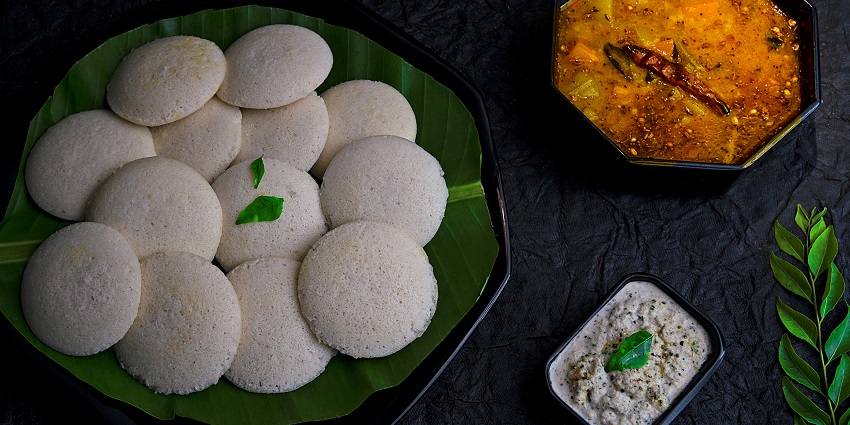 Try some delicious Idli sambar near the Puliyancholai Waterfalls in Tamil Nadu
