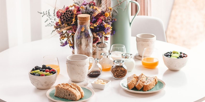A delicious breakfast spread featuring various meal items on a dining table.