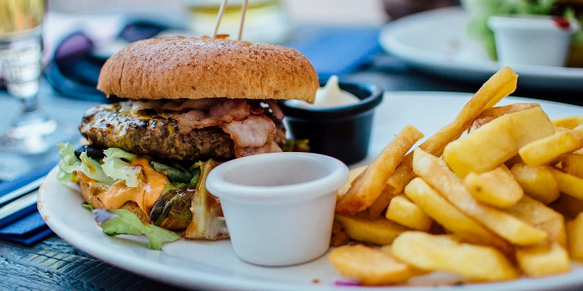 Image of food served at a restaurant with burger and fries on the side