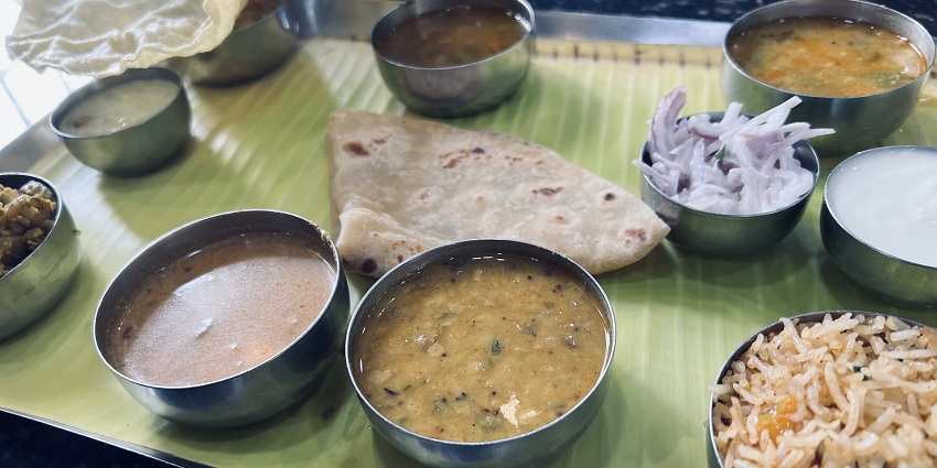 Delicious South Indian meal plated on a banana leaf which is delectable in taste.