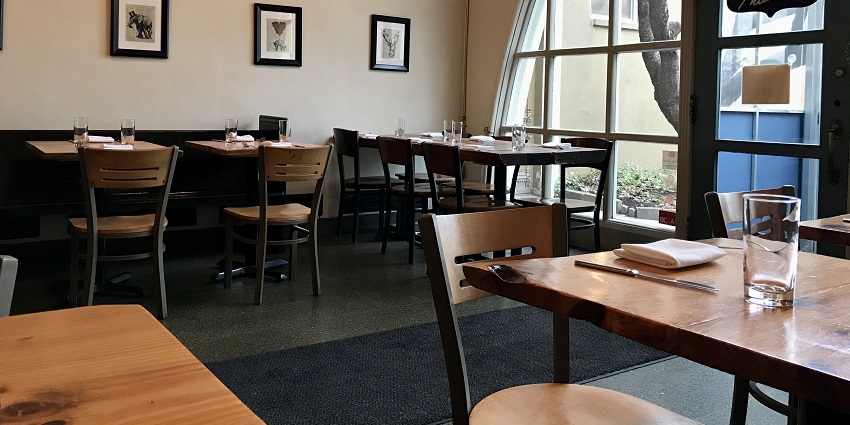 Cosy restaurant seating with stylish decor near Karumariamman Temple