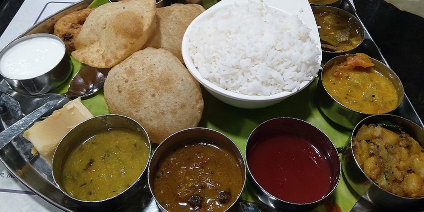 Food options include authentic South Indian cuisine.