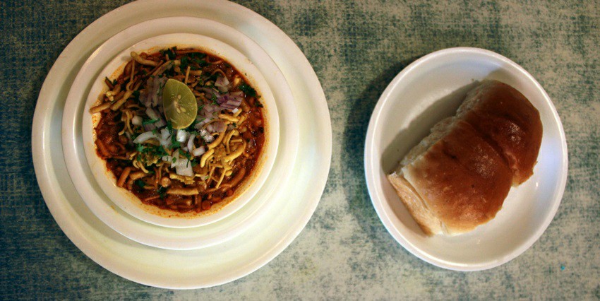 Image of a delectable Misal Pav, a Maharashtrian snack served on a plate