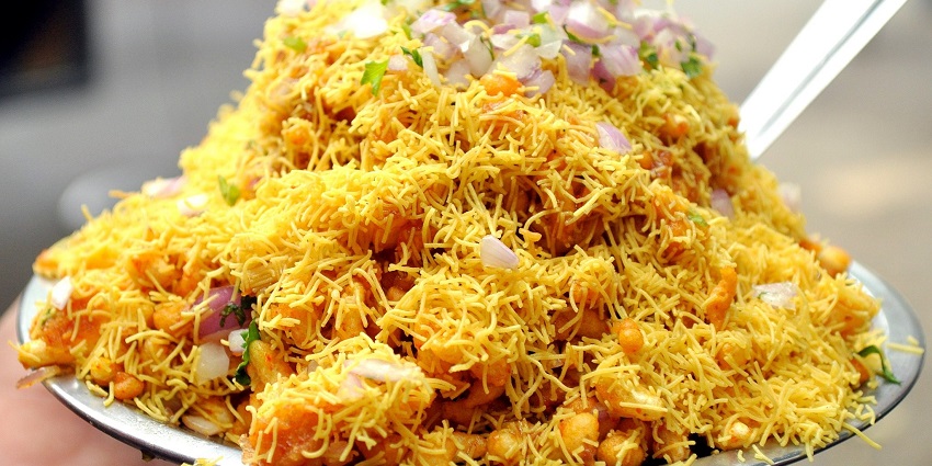 A picture of a famous snack food of Maharashtra, near the Chintamani Temple