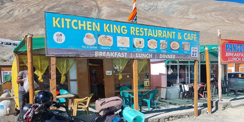 A picture of a restaurant in Ladakh with a view of mountains in the background