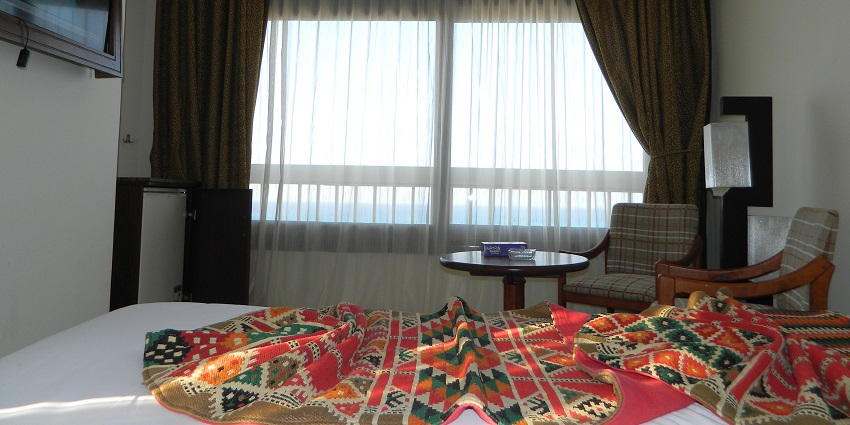 Cozy hotel room with stunning seaside views and calming ocean ambience near Shrivardhan Fort