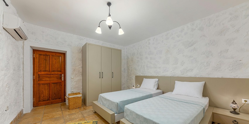 Spacious hotel room featuring cosy double beds for a restful night's sleep!