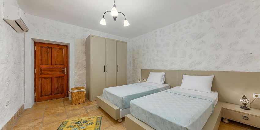 Elegant hotel room with inviting double beds, perfect for a relaxing getaway!