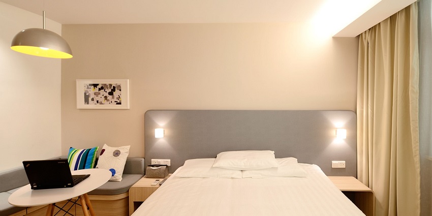Elegant hotel room suite featuring modern decor and cosy furnishings.