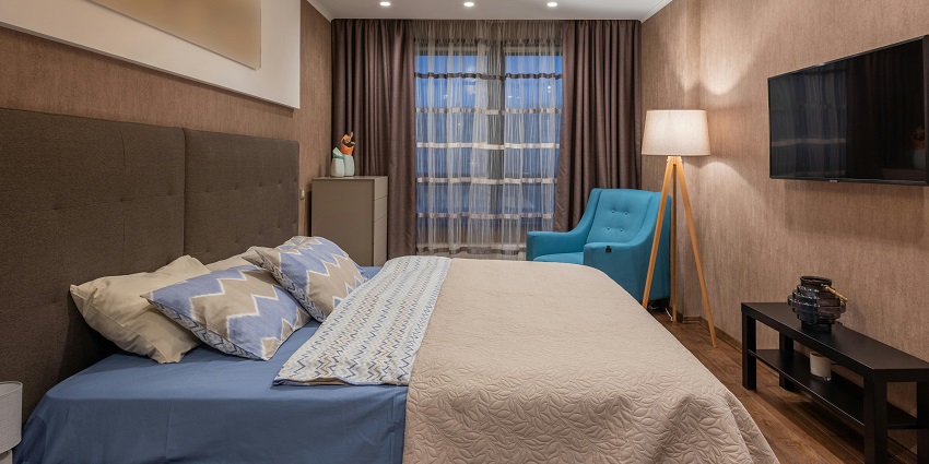 Stylish hotel room interior featuring modern decor, a large bed, and inviting ambiance