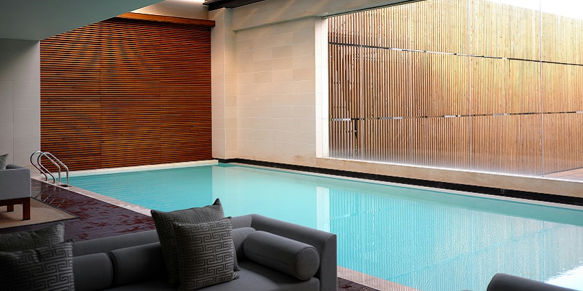 Spacious hotel room featuring a large private pool area for a relaxing night's sleep.