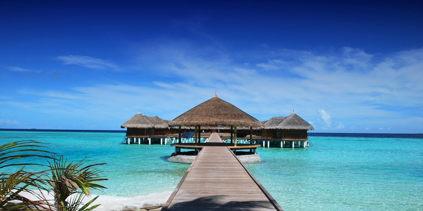 An image of The Lovina Bali Resort’s beachfront, offering ocean views and luxury accommodations