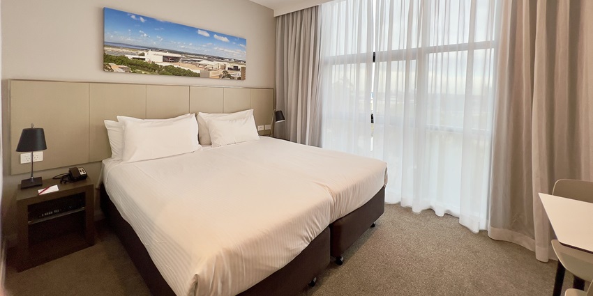 A picture of a hotel room near the Loknath Temple with all the basic amenities
