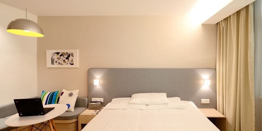 Elegant hotel room suite featuring modern decor and cosy furnishings.