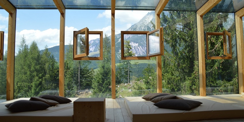Bright room with large windows, allowing natural light to illuminate the cosy interior