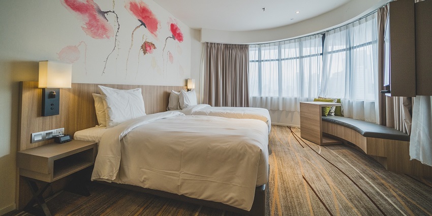 A cosy bed with clean sheets, creating a relaxing morning atmosphere
