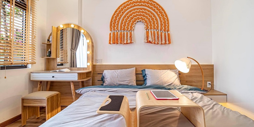 Coy bedroom featuring stylish interior design elements, including a comfortable bed.