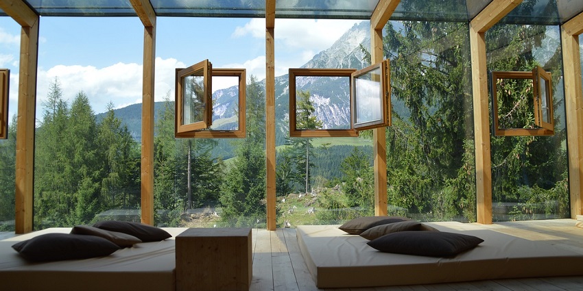 Bright room with large windows, allowing natural light to illuminate the cosy interior.