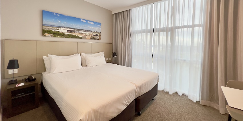 An image of a comfortable hotel room to stay during waterfalls in Ooty, Tamil Nadu.