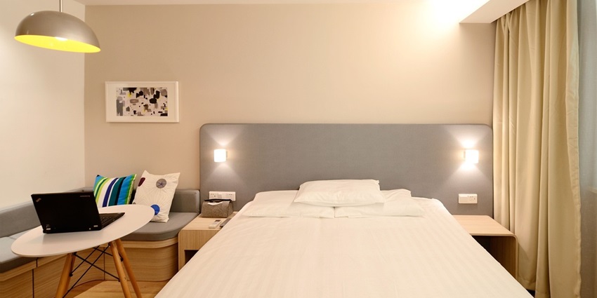 Elegant hotel room suite featuring modern decor and cosy furnishings.