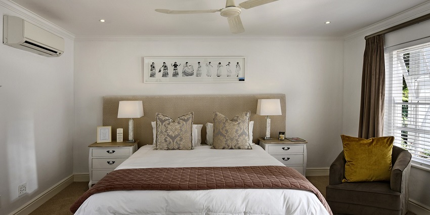 Cosy bed with a soft blanket, creating a warm and inviting atmosphere in a bedroom