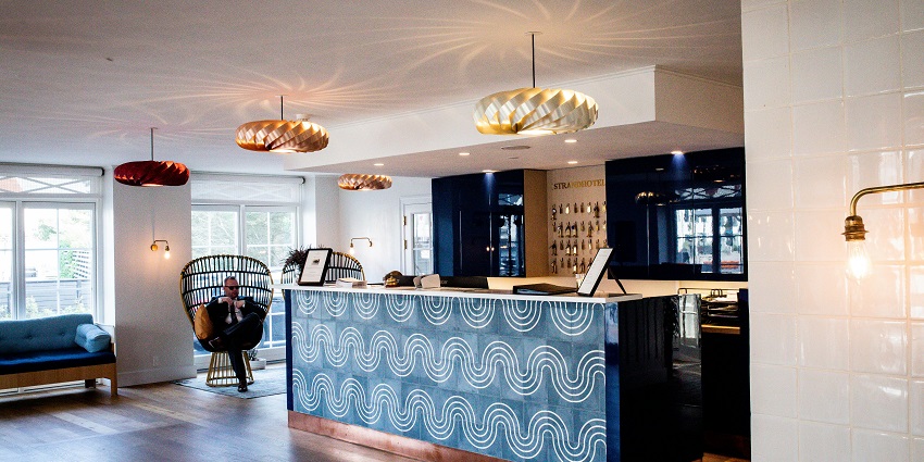 Luxurious hotel reception area, featuring elegant decor, and comfortable seating.