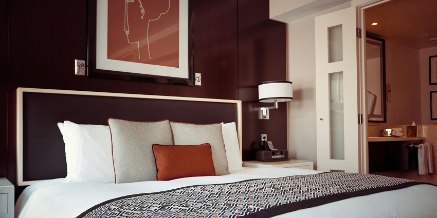 Chic black and grey bedspread beautifully arranged on a luxurious hotel bed