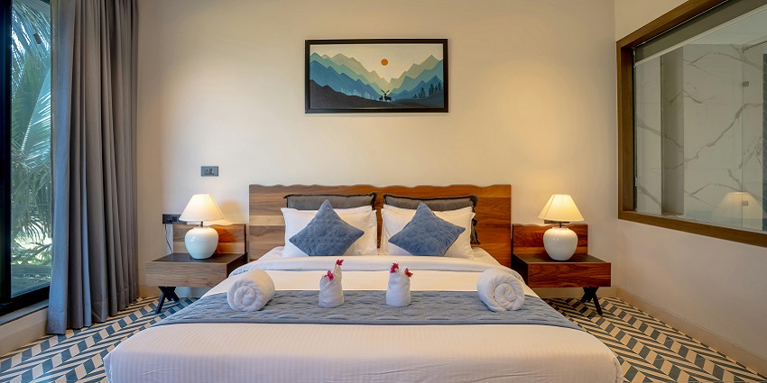 A luxurious villa bedroom in Saligao, Goa, featuring elegant decor and a cozy ambiance.