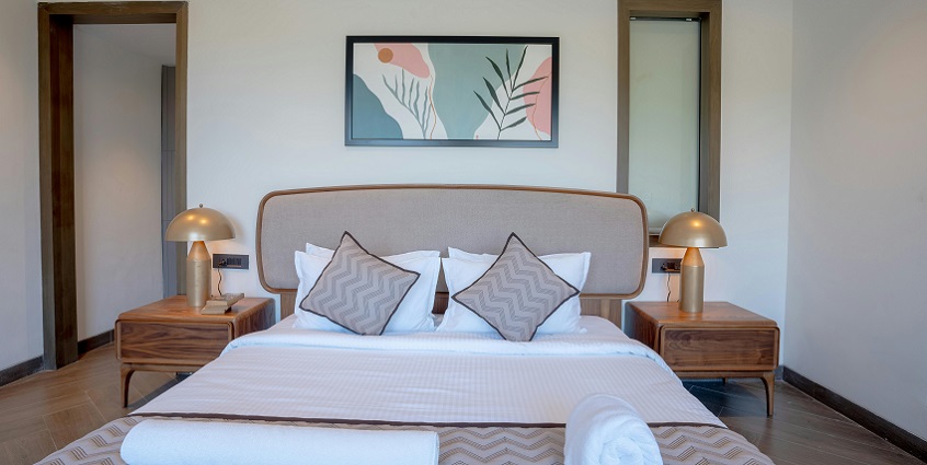 A picture of a hotel room with all the basic amenities